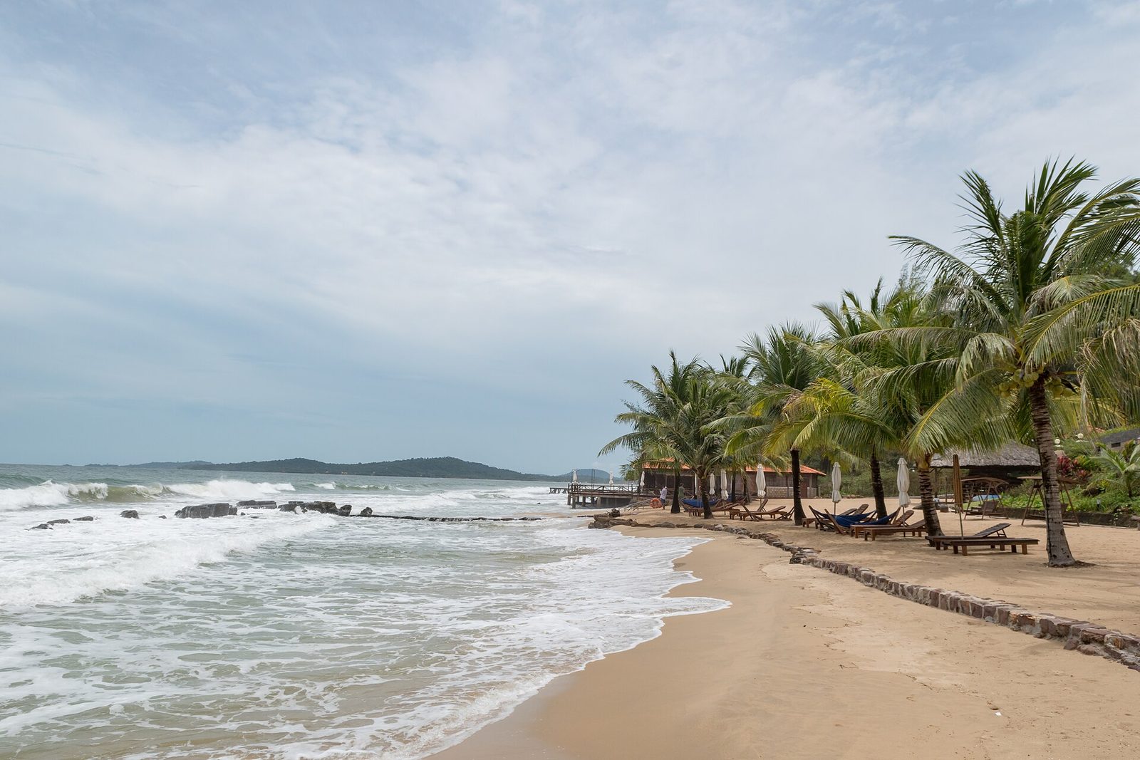 Calm shallow water and a sandy beach on Phu Quoc, the kind of shore that works for children