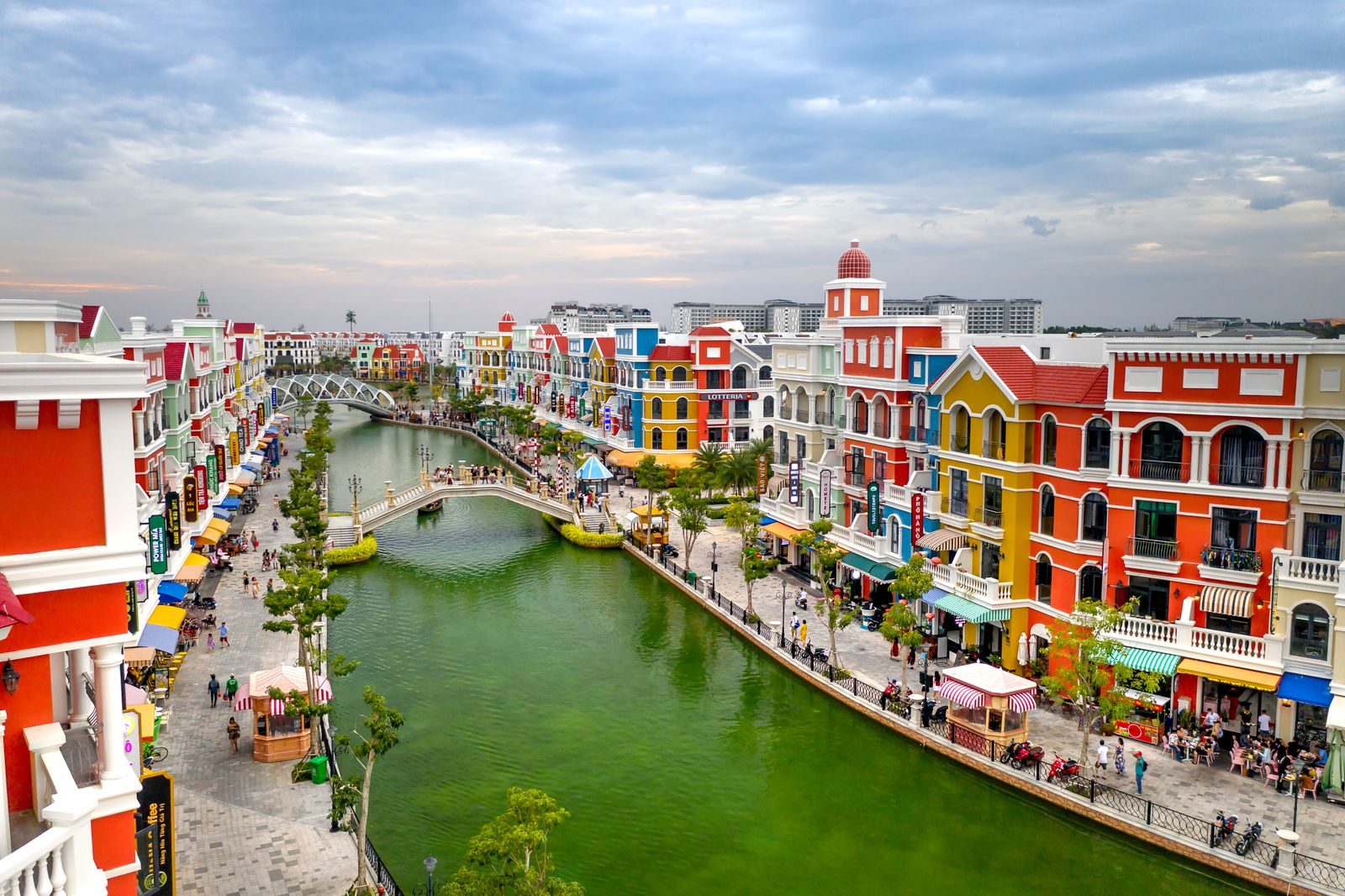 The canal and coloured facades at Grand World Phu Quoc, in daylight