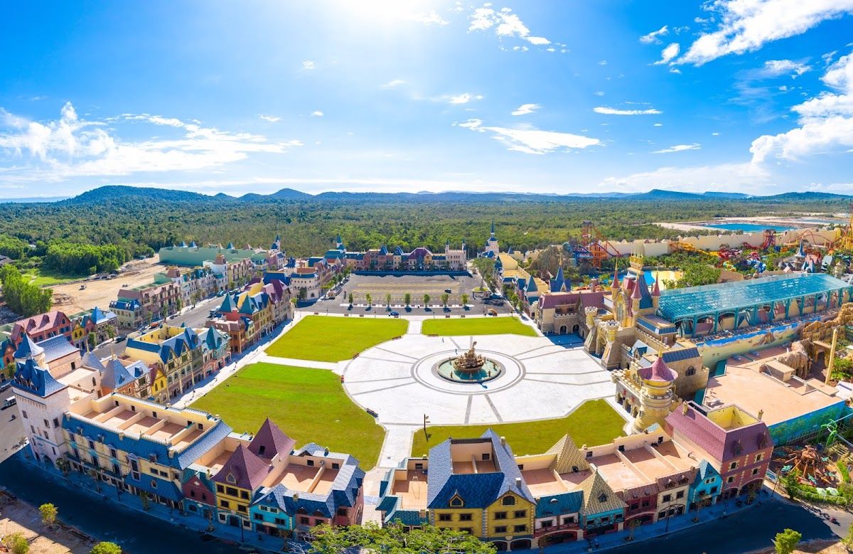 Aerial view of VinWonders Phu Quoc theme park showing colourful European-style facades and a circular central plaza